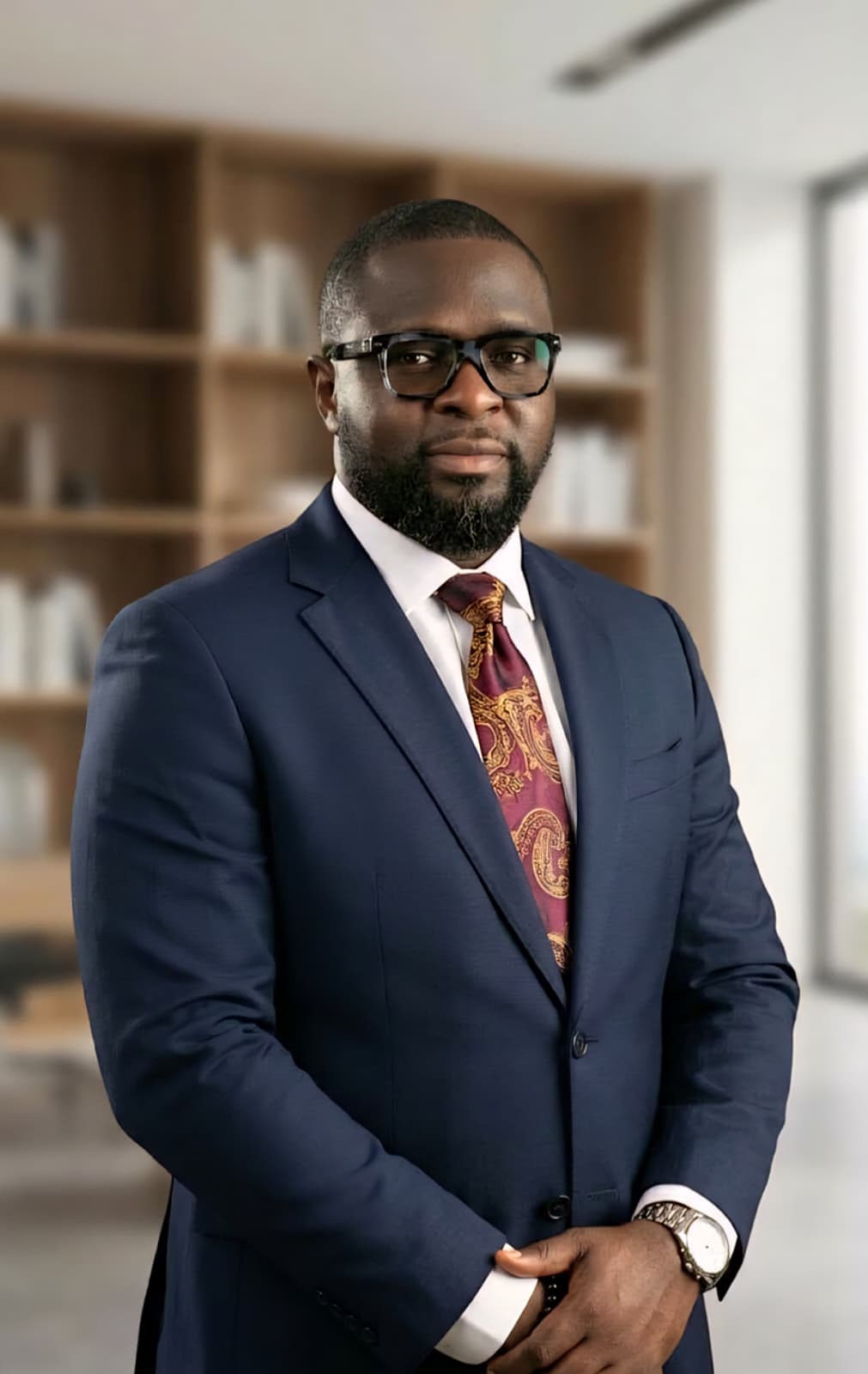Joseph Oladehinde in a professional office setting